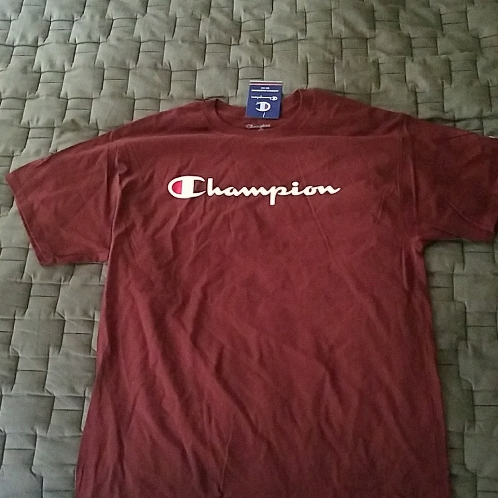 I am selling a brand new burgendy champions tee